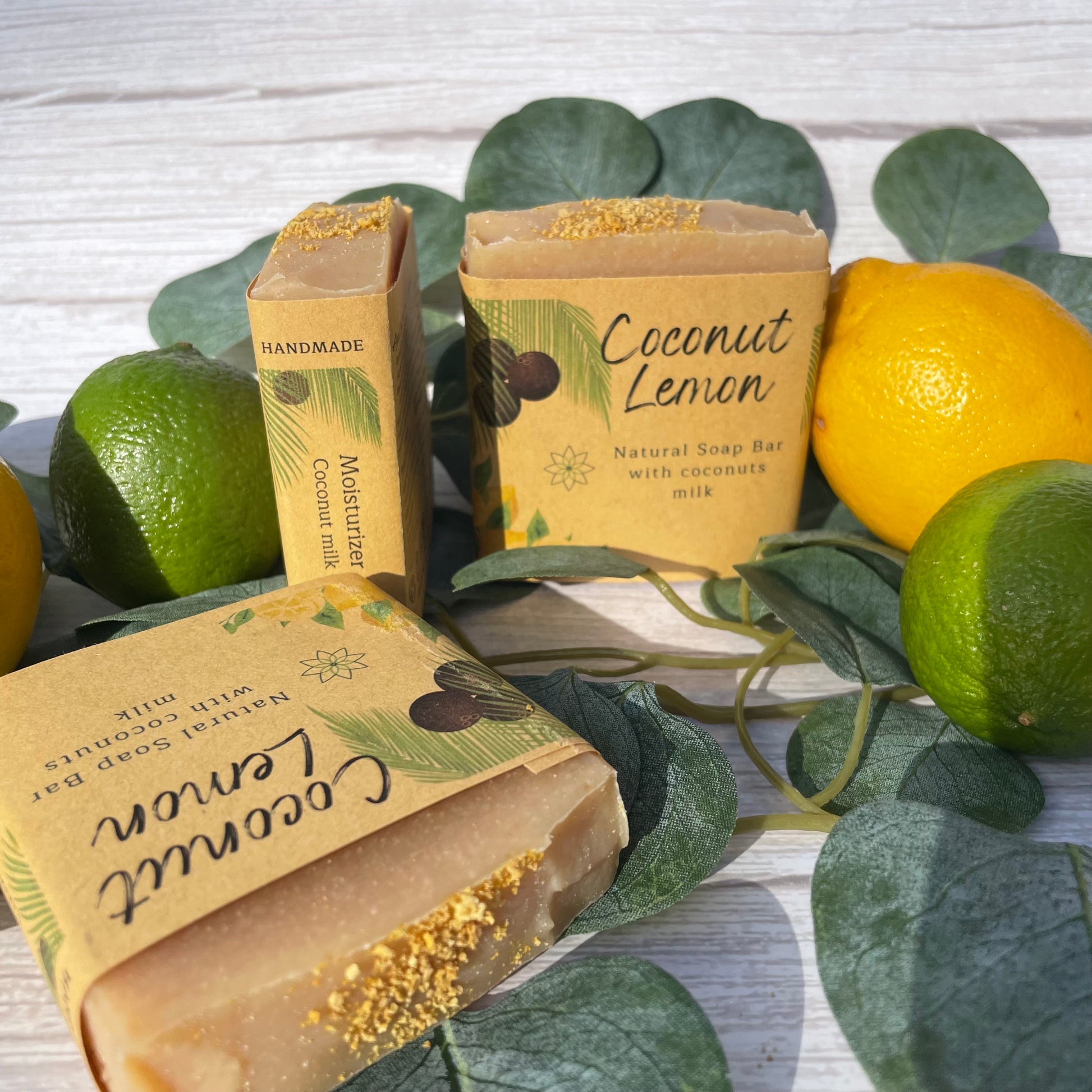 3 natural handcrafted coconut lemon soaps showing all sides, beautiful top, front and side labels, in the picture there are 4 lemon mix
