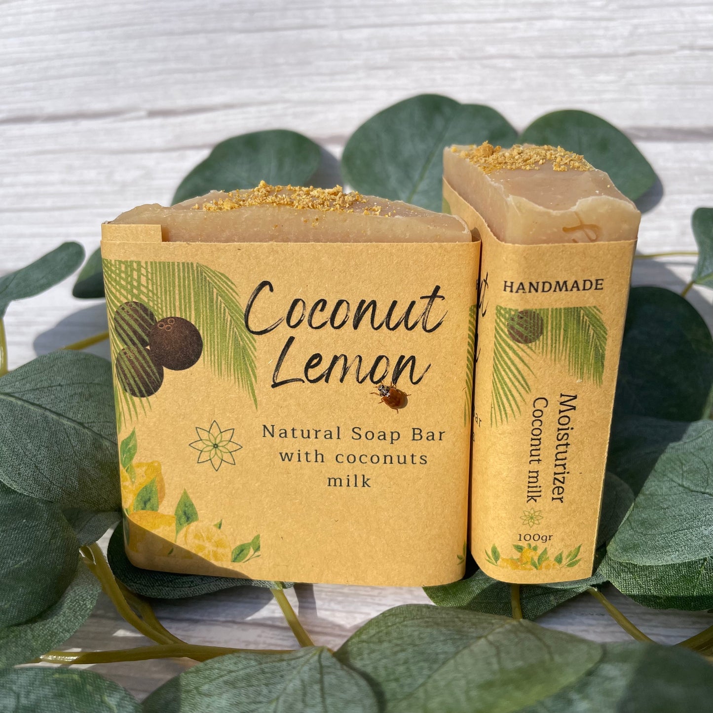 Vegan natural handcrafted Coconut Lemon soap, front and side to read the label in order to know that is made with real coconut milk and is specifically created to be a moisturizer soap with a tropical scent of coconut and zesty lemon